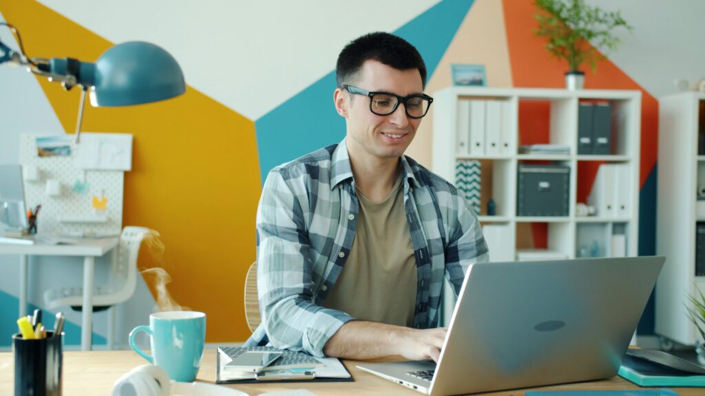 Free AI tools for freelancers on laptop screen